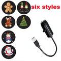 Black USB light with Christmas-themed projection designs on a white background