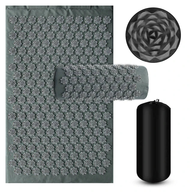 Gray acupressure mat with a close-up inset and a black carrying bag on a white background