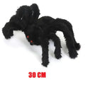 Black spider plush toy with red eyes on a white background, labeled 30 CM.