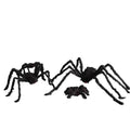 Two large black spiders on a white background
