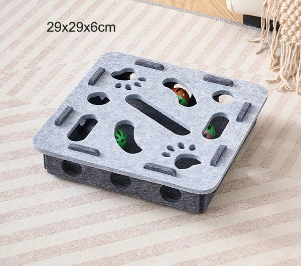 Gray foam block with various holes on a striped fabric background