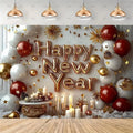 A festive New Year party backdrop featuring metallic gold 'Happy New Year' foil balloons, red and white balloons, gold star decorations, candles, and hanging pendant lights above a wooden floor.