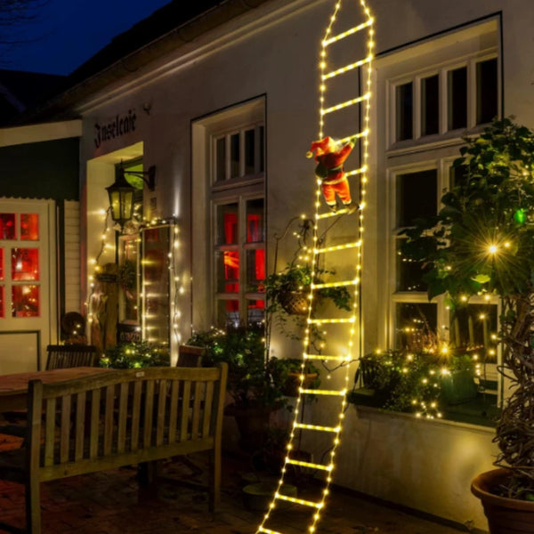 Decorative ladder with lights on a building exterior at night