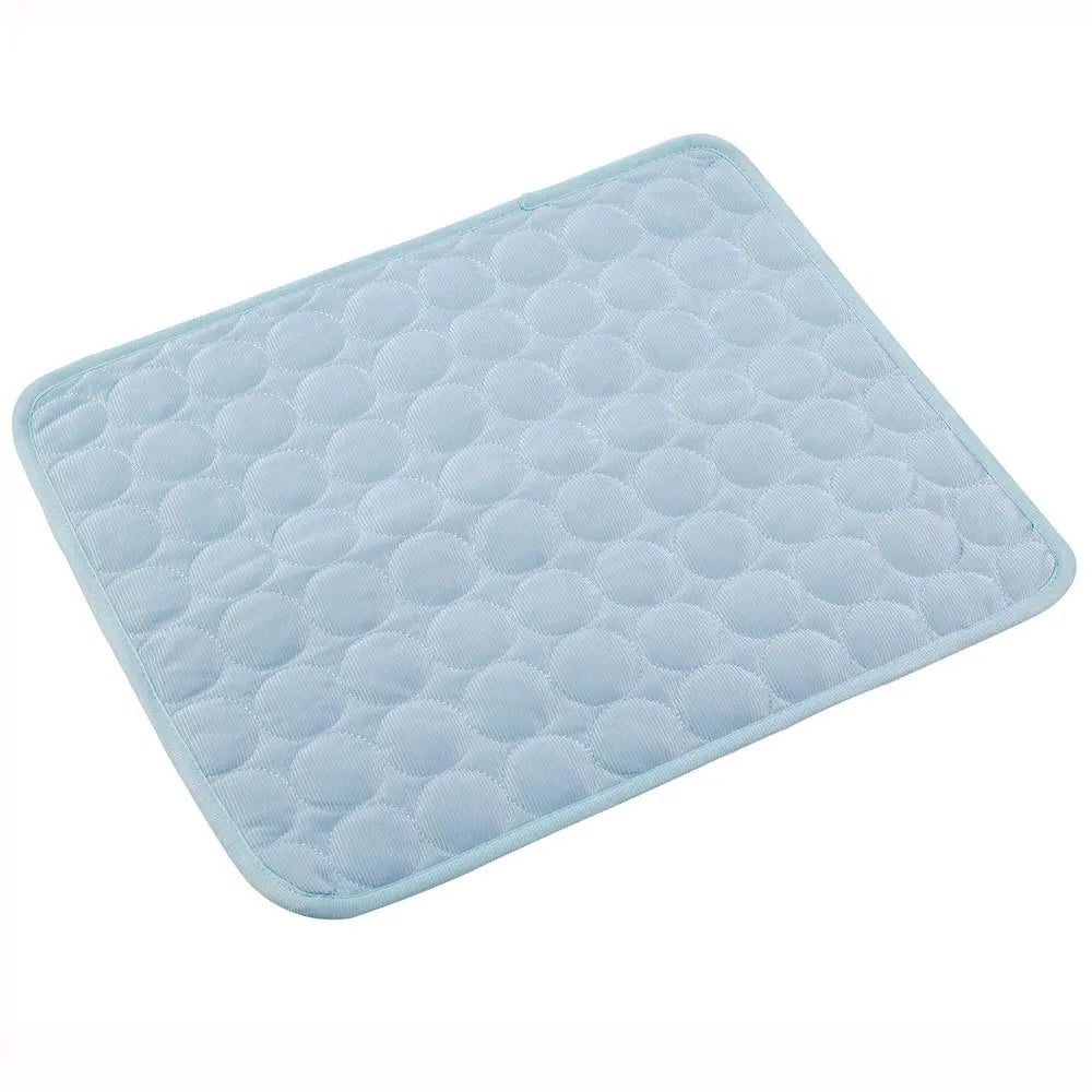 A light blue quilted cooling pad with a circular bubble pattern and rounded corners, shown on a plain white background.
