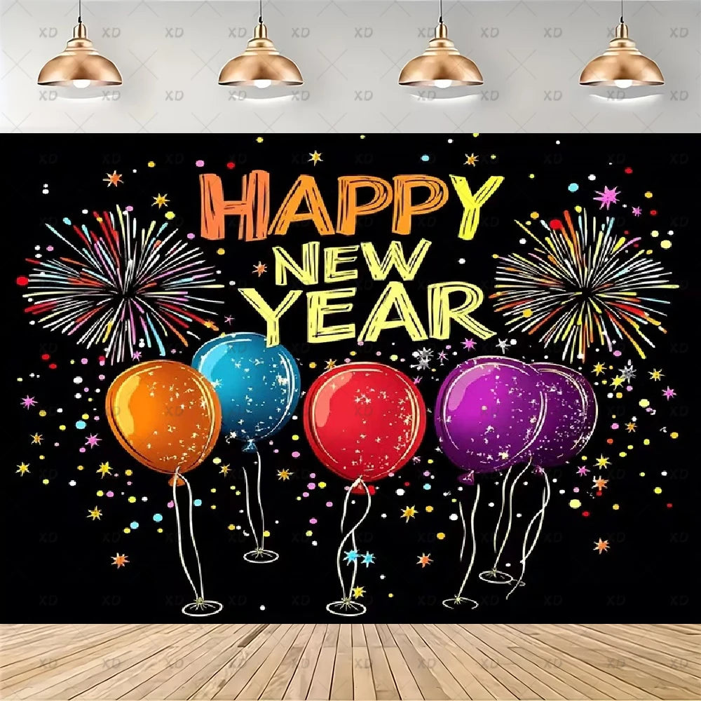 A festive New Year party backdrop featuring the text 'HAPPY NEW YEAR' in large gold and orange letters above four colorful balloons (orange, blue, red, purple) on a black background with fireworks and star confetti. The backdrop is shown hanging in a room mockup with a light gray wall, hanging copper pendant lights, and a light wood floor.