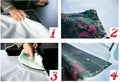 Step-by-step process of ironing a decorative fabric with floral patterns.