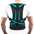 Black posture corrector with blue accents on a person wearing a white shirt.