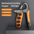 Orange and black mechanical counting gripper on a dark background