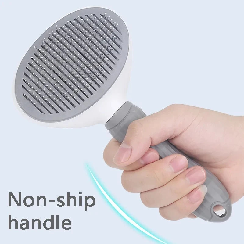 Gray handheld shower head held by a hand with a light blue background