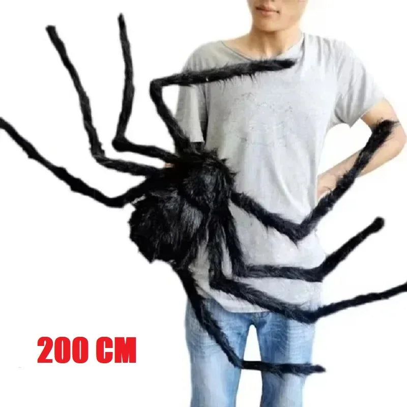 Large black spider prop held by a person, with a measurement label '200 CM'.