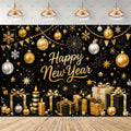 A festive New Year party backdrop featuring a black background decorated with gold and silver ornaments, hanging lights, fireworks, snowflakes, bunting, candles, gift boxes, and the words 'Happy New Year' in gold script. The scene is shown with a wood floor and ceiling lights above.