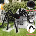 Halloween spider decoration with red eyes and bendable legs in front of tombstones.
