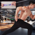 Man exercising with a purple resistance band in a gym setting, highlighting its durability.