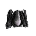 Black furry glove with a light bulb inside on a white background
