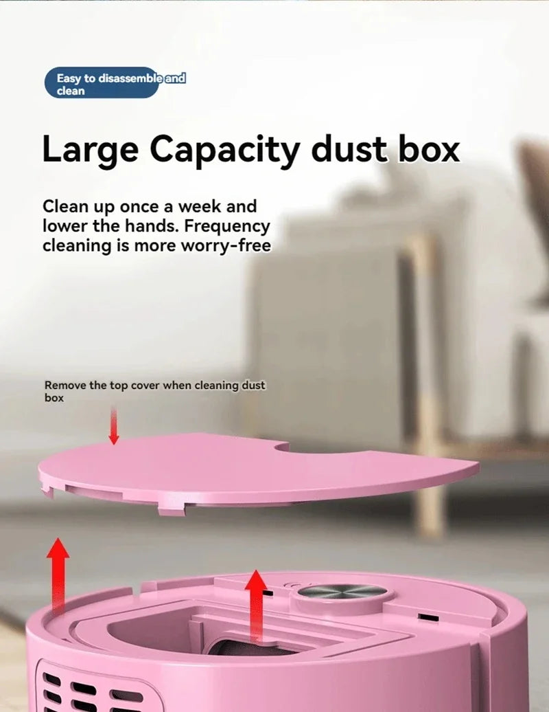 Pink large capacity dust box with cleaning instructions on a blurred background