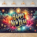 A festive New Year backdrop featuring a colorful fireworks pattern with the text 'Happy New Year' in large gold lettering, shown hanging on a wall above a wooden floor with hanging pendant lights above.
